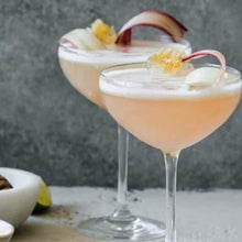 Load image into Gallery viewer, Cherry and Apple Kombucha in cocktail glass with rhubarb garnish
