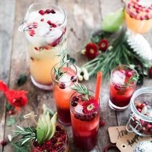 Load image into Gallery viewer, Kombucha in glass garnished with fresh fruits and sprigs of rosemary
