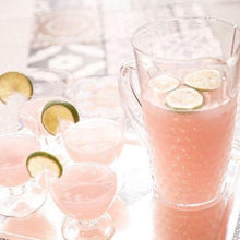 Load image into Gallery viewer, Dark Forest Sparkling Pink Lemonade Kombucha in a jug with lime

